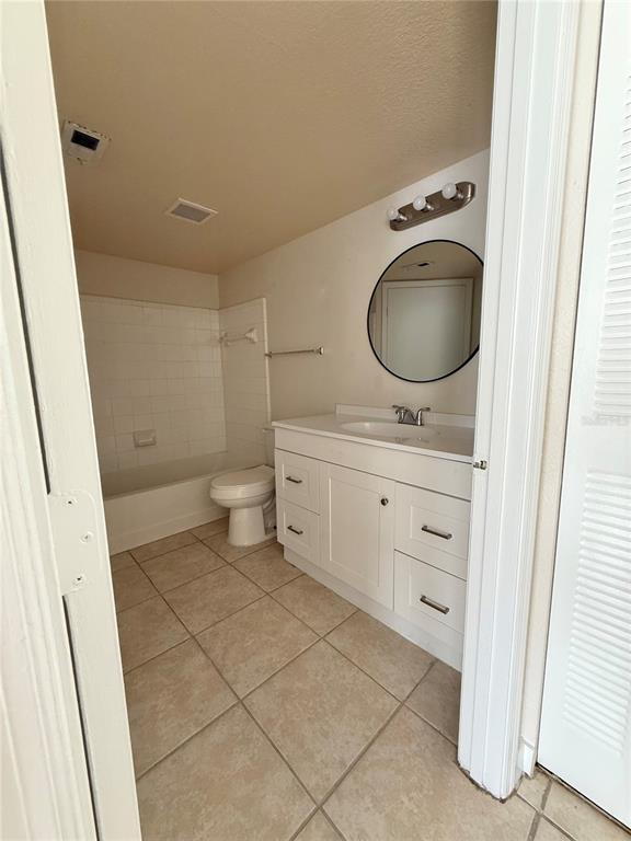 2201 Key W Court, Unit 314 Kissimmee, FL 34741 - Photo 30 of 58 a bathroom with a sink a toilet and a mirror