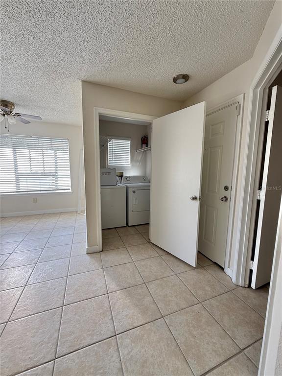 2201 Key W Court, Unit 314 Kissimmee, FL 34741 - Photo 34 of 58 a room with a stove top oven and cabinets