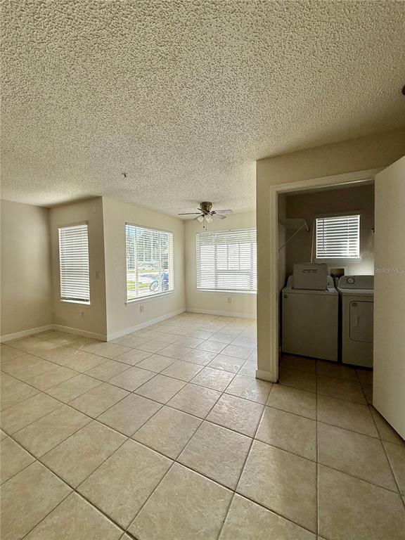 2201 Key W Court, Unit 314 Kissimmee, FL 34741 - Photo 36 of 58 a view of an empty room and a kitchen