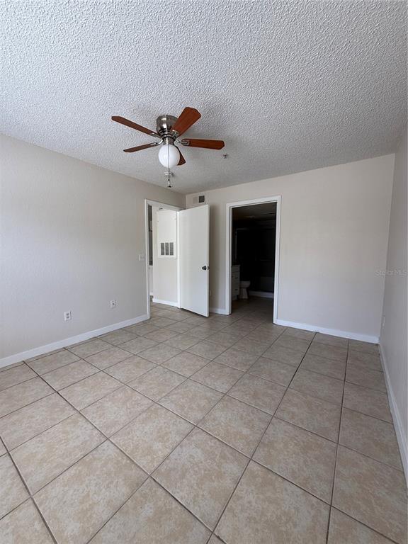 2201 Key W Court, Unit 314 Kissimmee, FL 34741 - Photo 38 of 58 a view of an empty room with a window