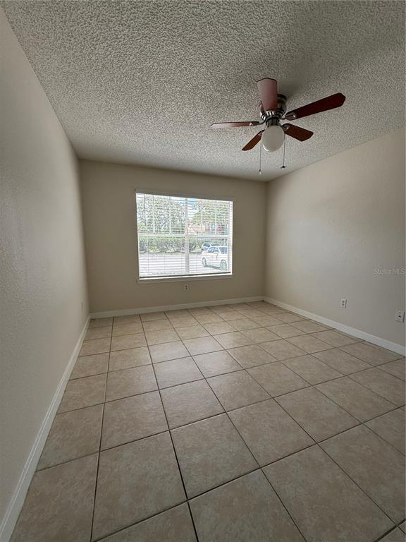 2201 Key W Court, Unit 314 Kissimmee, FL 34741 - Photo 39 of 58 a view of an empty room with a window
