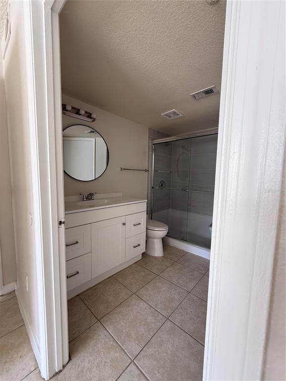 2201 Key W Court, Unit 314 Kissimmee, FL 34741 - Photo 42 of 58 a bathroom with a toilet sink and mirror