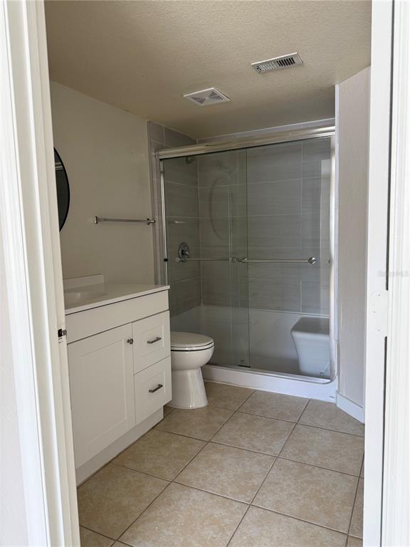 2201 Key W Court, Unit 314 Kissimmee, FL 34741 - Photo 43 of 58 a bathroom with a shower a toilet and a sink