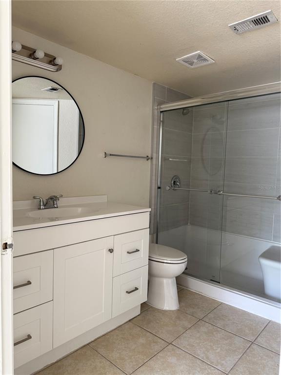 2201 Key W Court, Unit 314 Kissimmee, FL 34741 - Photo 44 of 58 a bathroom with a sink toilet and shower