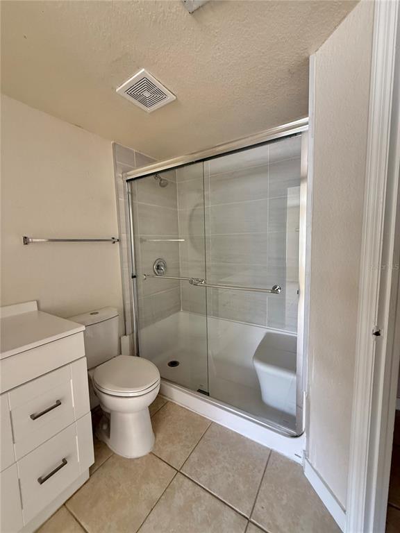 2201 Key W Court, Unit 314 Kissimmee, FL 34741 - Photo 47 of 58 a bathroom with a shower a toilet and a sink