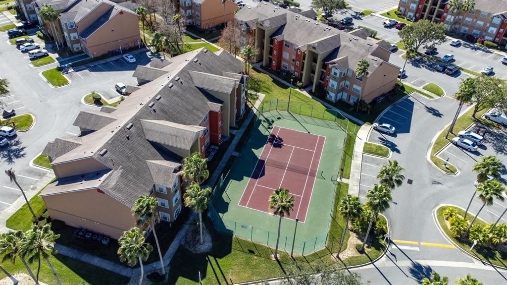 2201 Key W Court, Unit 314 Kissimmee, FL 34741 - Photo 54 of 58 an aerial view of a house with a garden and swimming pool