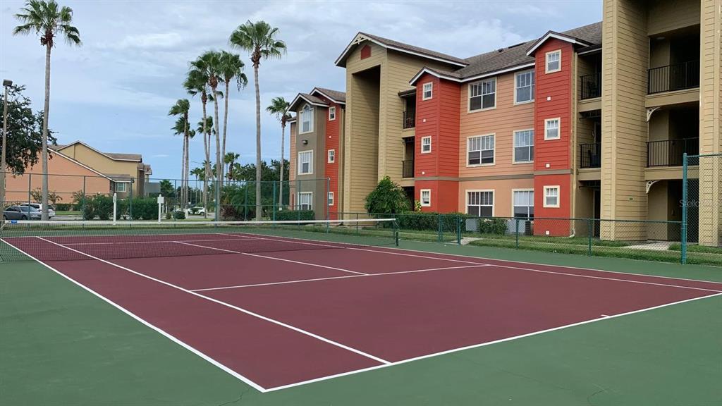 2201 Key W Court, Unit 314 Kissimmee, FL 34741 - Photo 55 of 58 a tennis court that has a tree in front of it