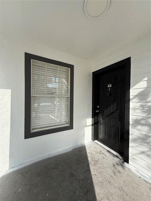 2201 Key W Court, Unit 314 Kissimmee, FL 34741 - Photo 7 of 58 a view of an empty room with a bathroom and a window