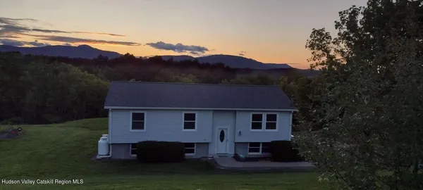 a view of a house with a garden