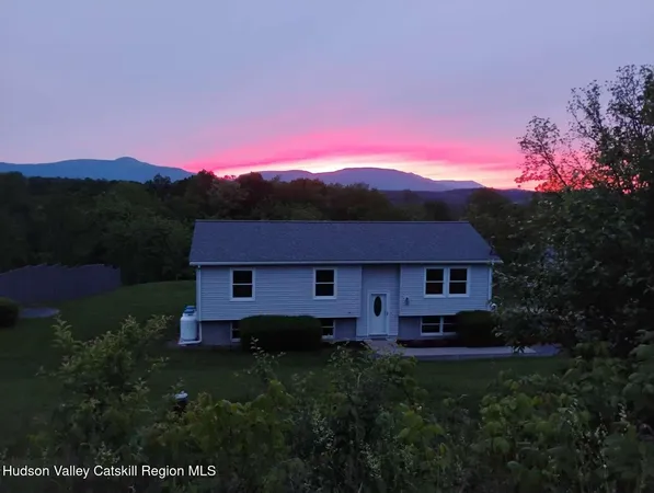 a kitchen with a refrigerator and white cabinets