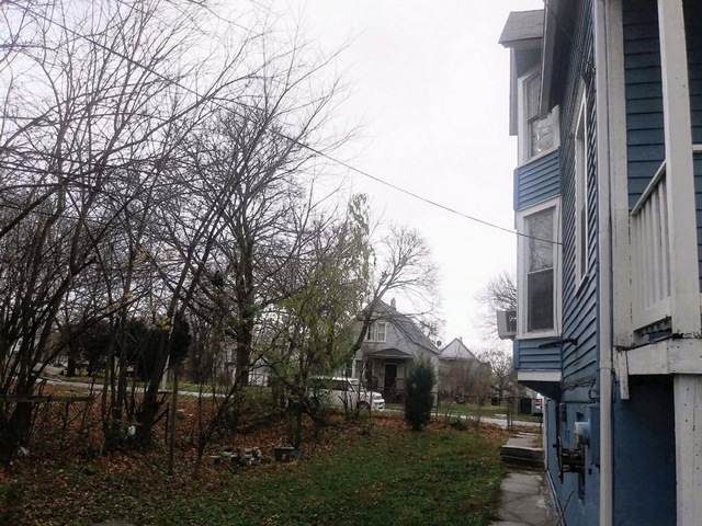 5921 South Aberdeen Street Chicago, IL 60621 - Photo 4 of 7 a view of multiple houses with yard