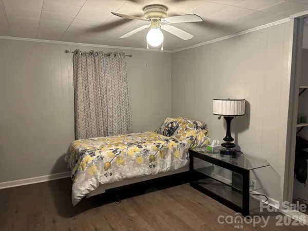 a bedroom with bed and a window