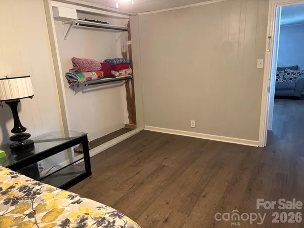 a view of a living room and wooden floor