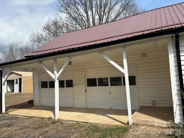 a view of a house with wooden fence