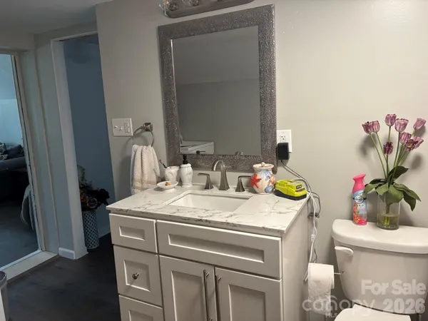 a view of bathroom with a sink and a toilet
