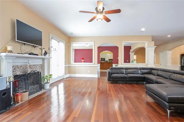 a living room with furniture and a fireplace