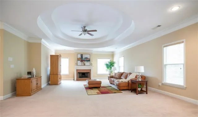 a living room with furniture and a fireplace