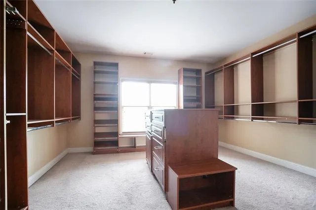 a living room with a couch and a window