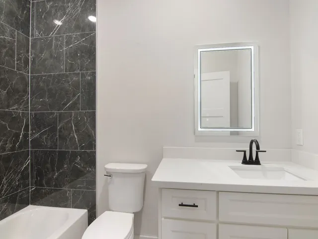 a bedroom with bed and a window