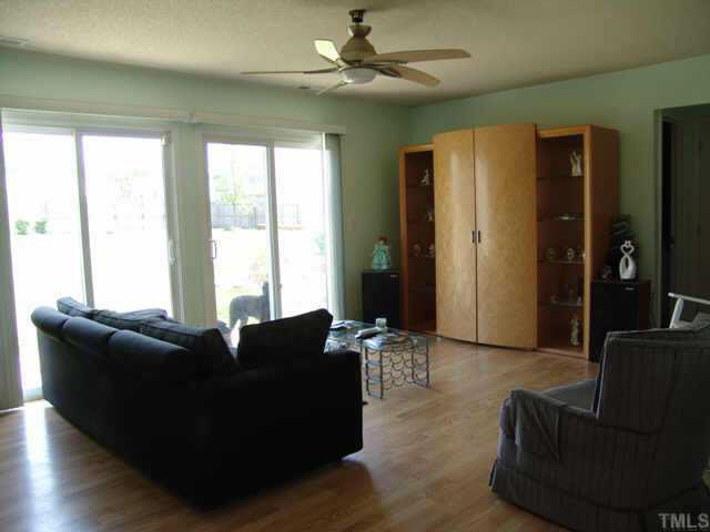 4808 Shallowbrook Trail Raleigh, NC 27616 - Photo 5 of 10 a living room with furniture and a large window