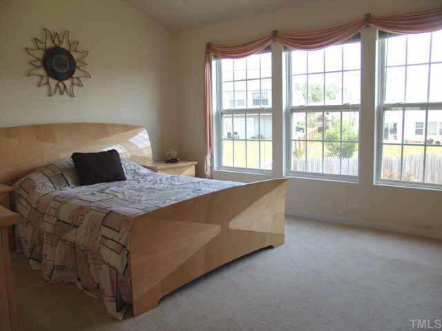 4808 Shallowbrook Trail Raleigh, NC 27616 - Photo 6 of 10 a bedroom with a bed and window