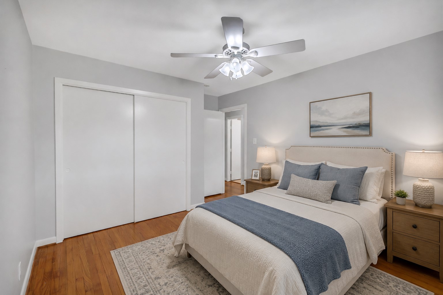 4415 Spellman Road Houston, TX 77035 - Photo 14 of 19 The first secondary bedroom is located at the end of the hallway and offers real hardwood flooring, a ceiling fan with light fixture, and a large wall closet with sliding doors. It also has double paned windows with plantation shutters NOTE: This photo has been virtually staged.