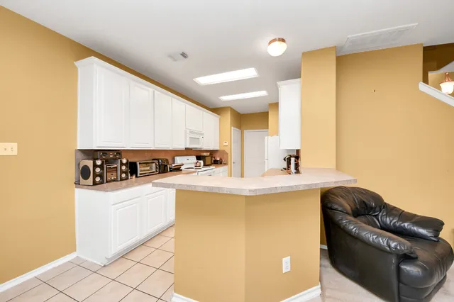 a bedroom with a bed and a television