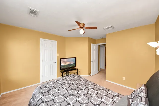 a view of a backyard with wooden fence