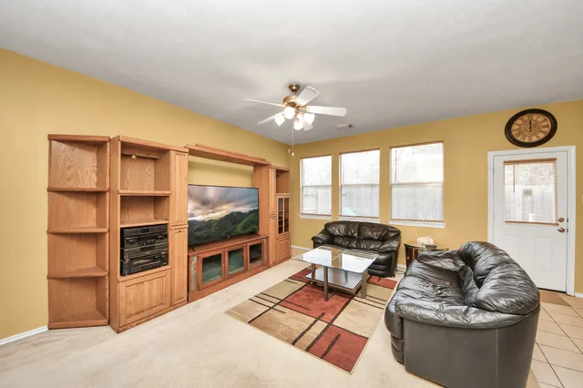 a kitchen with stainless steel appliances granite countertop a sink and white cabinets