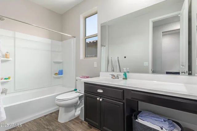 a bathroom with a sink a toilet and a bathtub