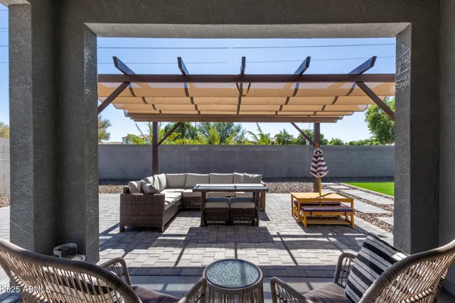 a patio with patio table and chairs