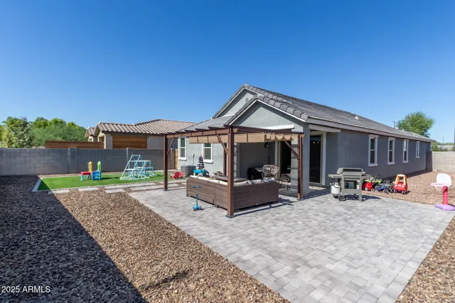 a front view of house with outdoor seating