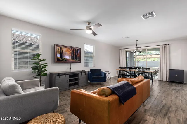 a living room with furniture fireplace and a flat screen tv