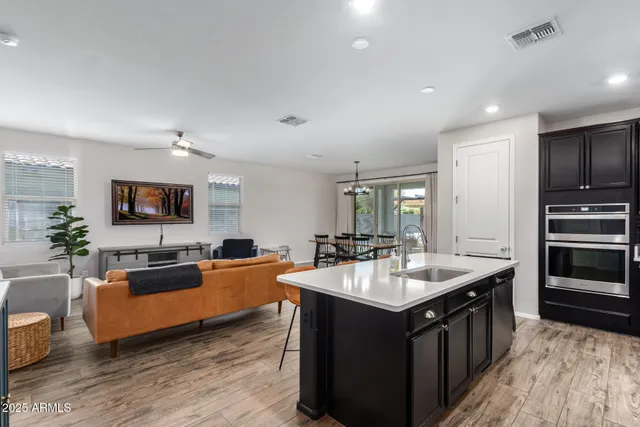 a kitchen with granite countertop a sink and counter top space