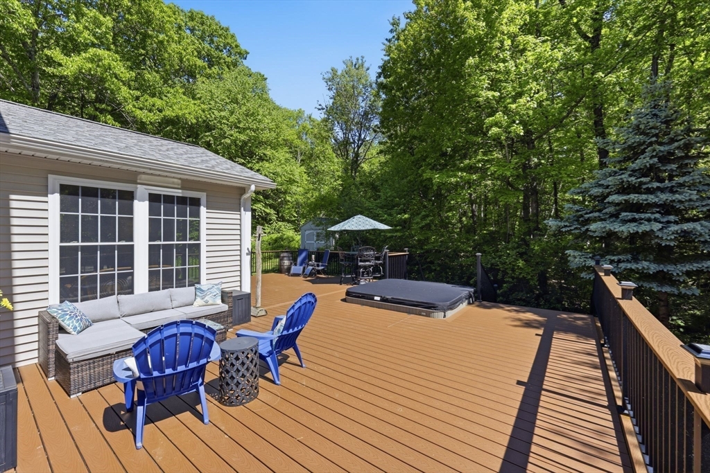 345 Bragg Road Warren, MA 01585 - Photo 35 of 41 a view of a roof deck with chair and table