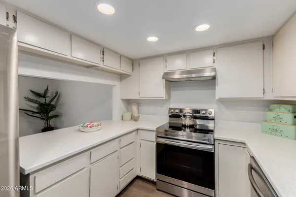 a view of a workspace with furniture and a potted plant