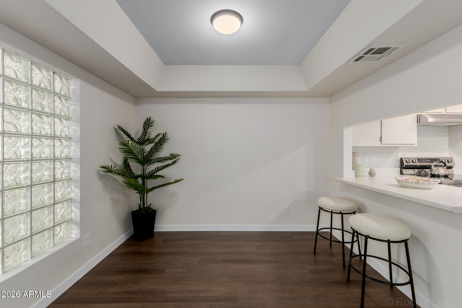 214 East Ruth Avenue, Unit 103 Phoenix, AZ 85020 - Photo 12 of 23 a view of a workspace with furniture and a potted plant