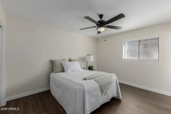 a bedroom with a bed and a closet