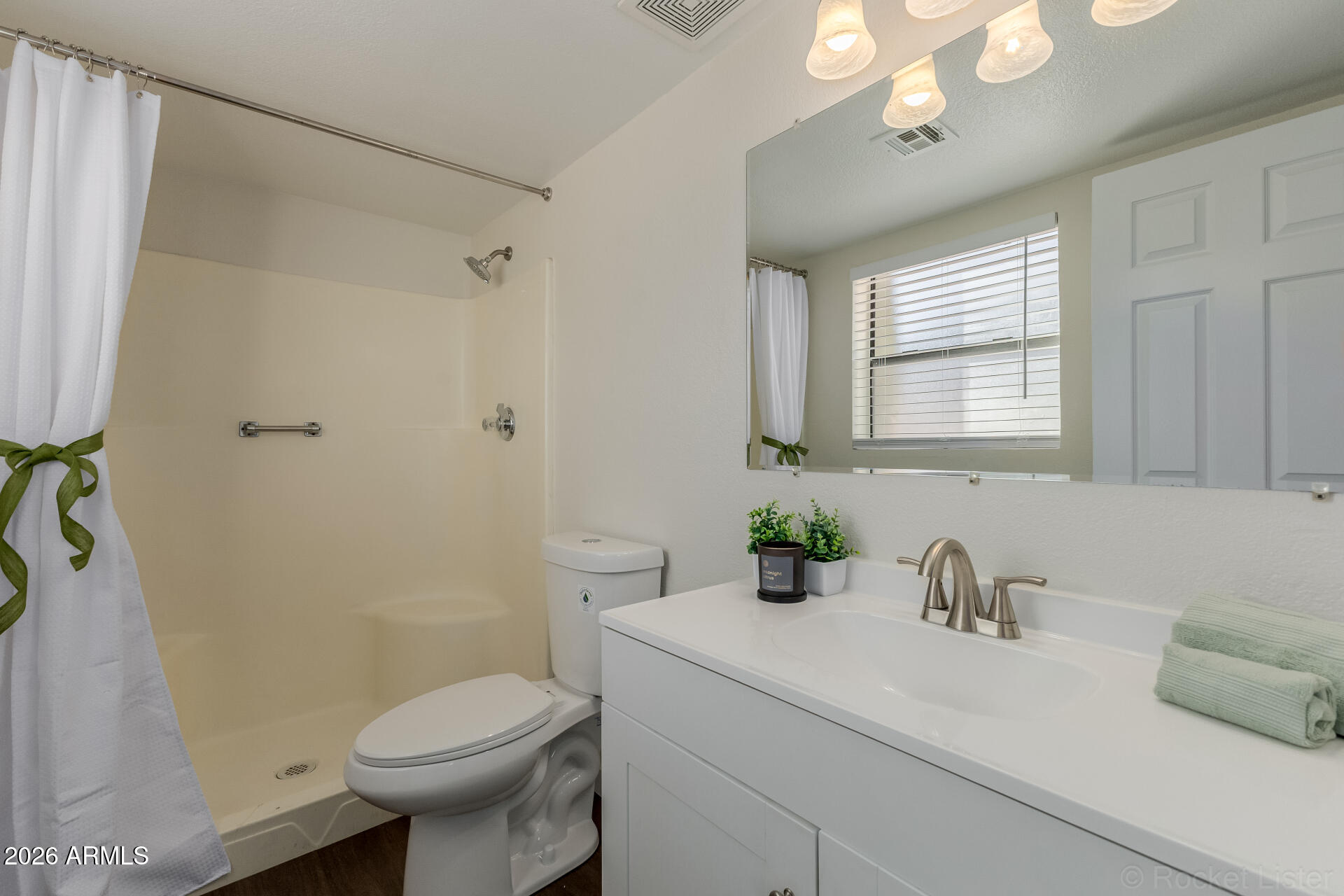 214 East Ruth Avenue, Unit 103 Phoenix, AZ 85020 - Photo 17 of 23 a bathroom with a sink toilet and shower