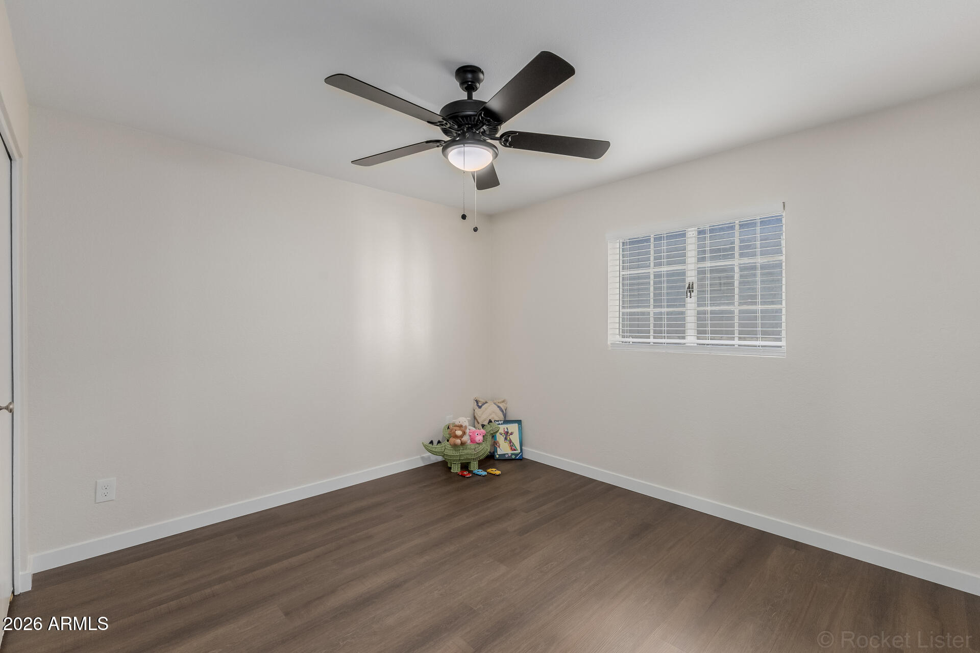 214 East Ruth Avenue, Unit 103 Phoenix, AZ 85020 - Photo 18 of 23 a view of workspace with wooden floor and ceiling fan