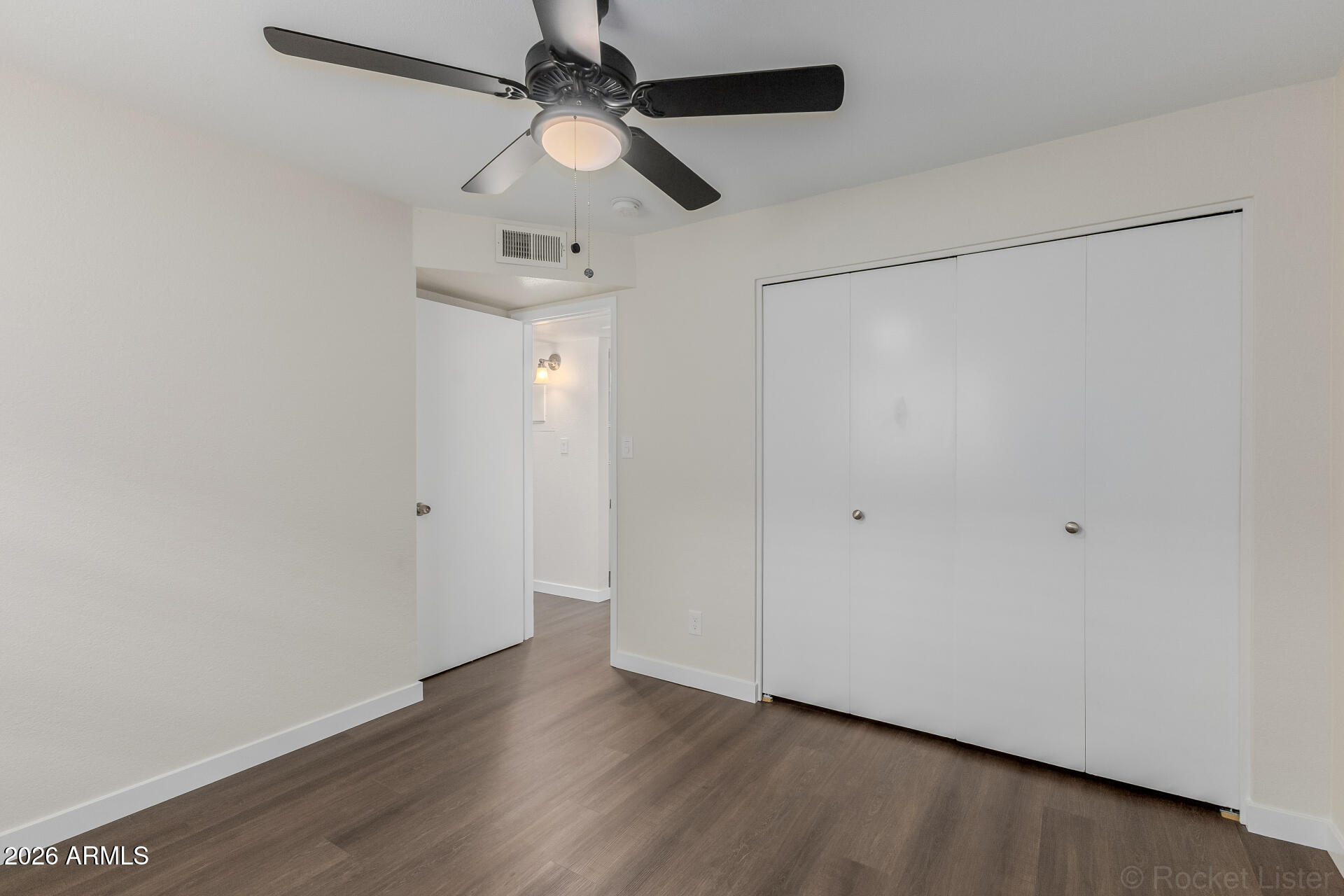 214 East Ruth Avenue, Unit 103 Phoenix, AZ 85020 - Photo 19 of 23 a view of a room with wooden floor