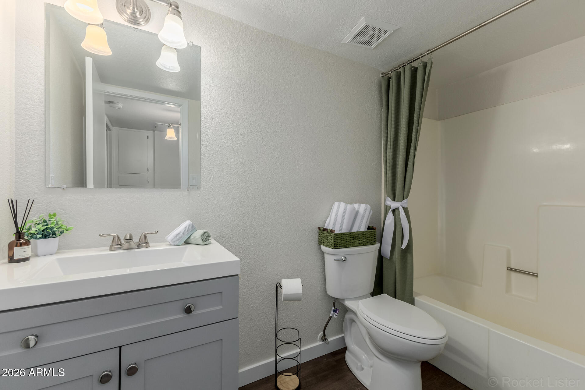 214 East Ruth Avenue, Unit 103 Phoenix, AZ 85020 - Photo 20 of 23 a bathroom with a sink toilet and shower
