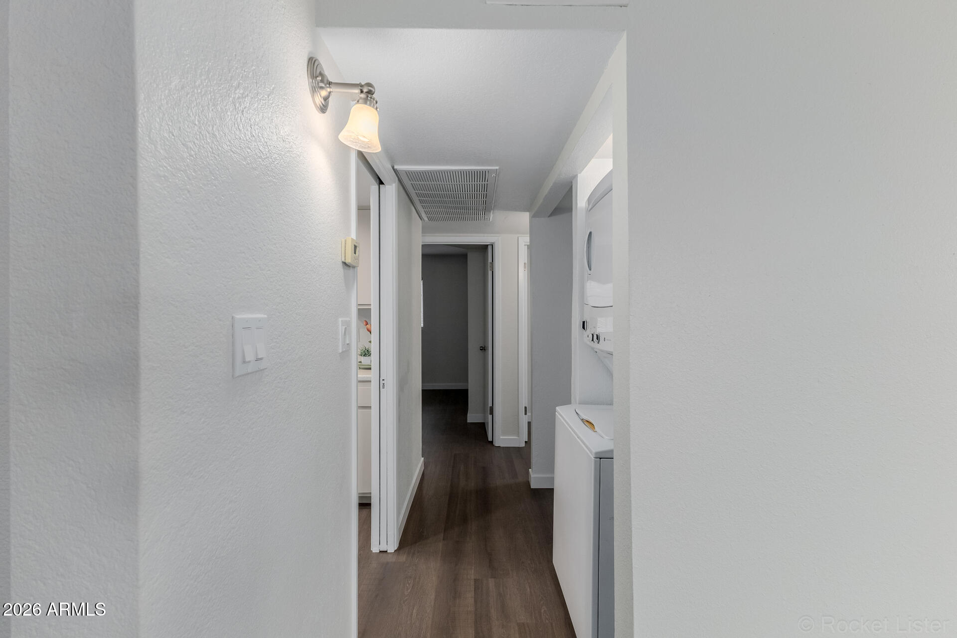 214 East Ruth Avenue, Unit 103 Phoenix, AZ 85020 - Photo 21 of 23 a view of a hallway with wooden floor and closet