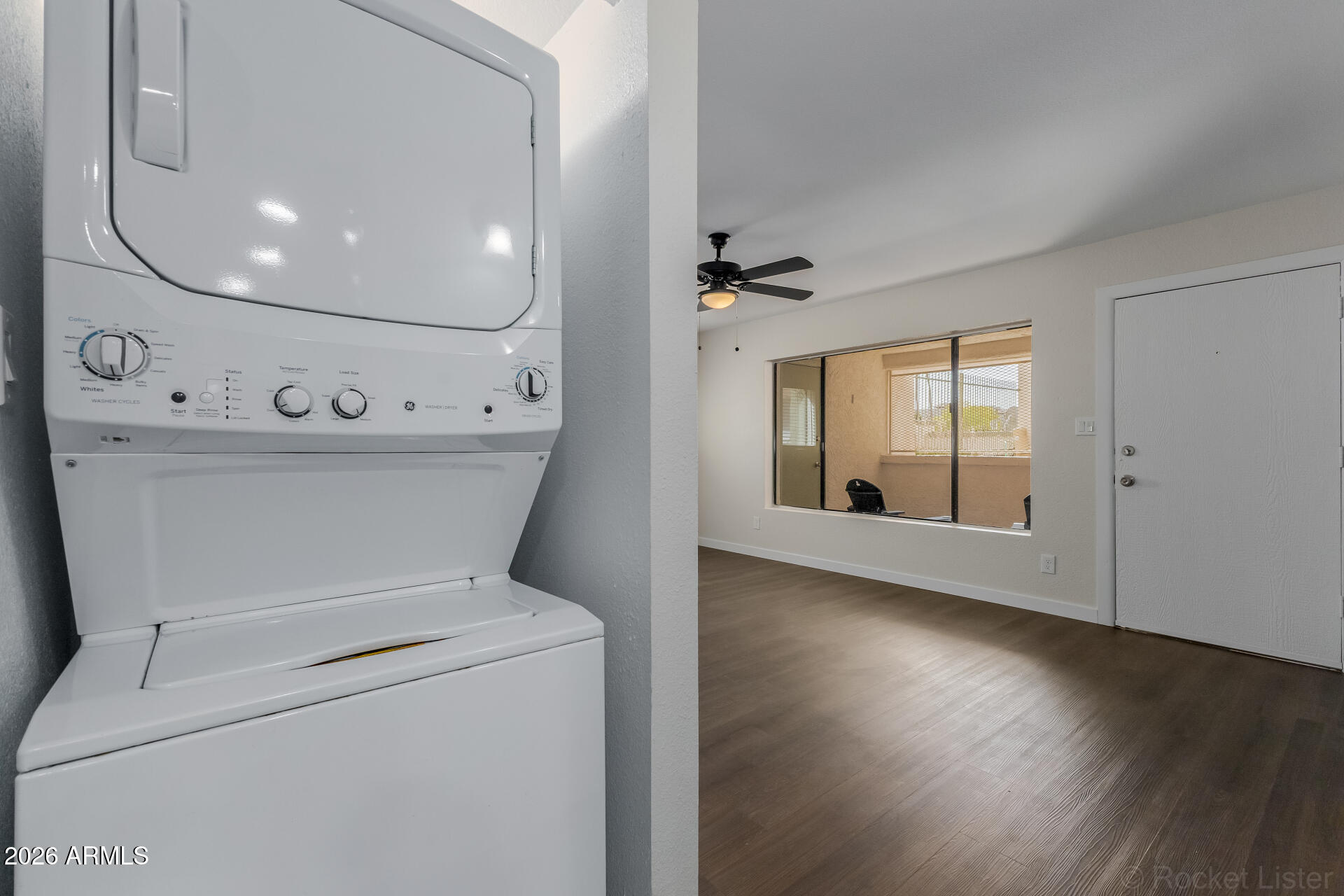 214 East Ruth Avenue, Unit 103 Phoenix, AZ 85020 - Photo 22 of 23 a view of washer and dryer with wooden floor