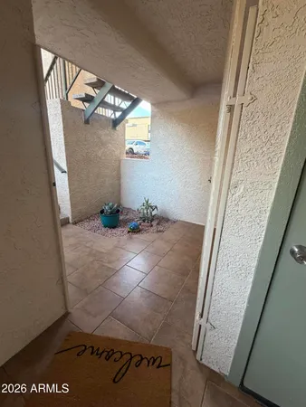 a view of a entryway door and dining room