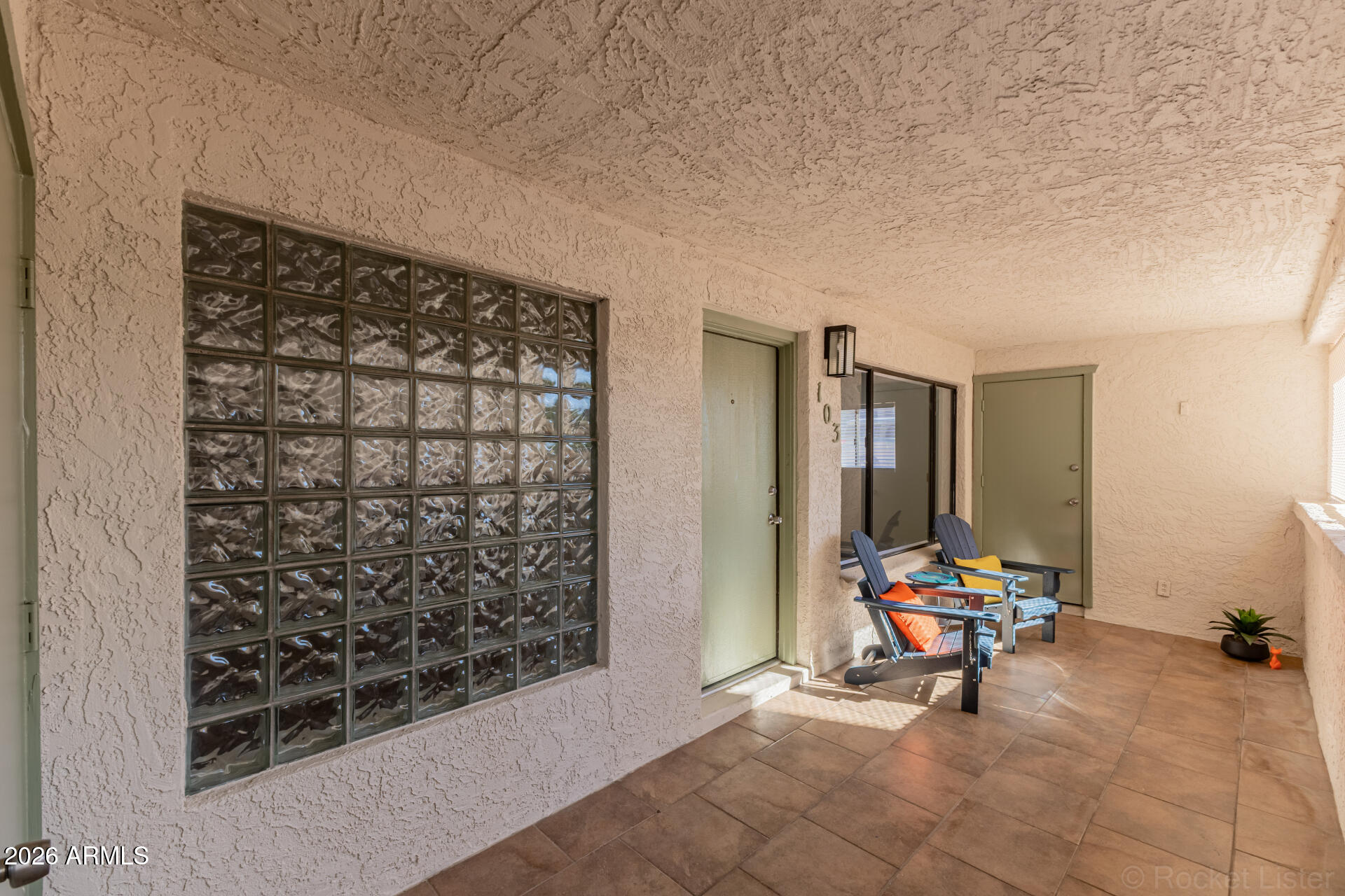 214 East Ruth Avenue, Unit 103 Phoenix, AZ 85020 - Photo 4 of 23 a view of a entryway door and dining room