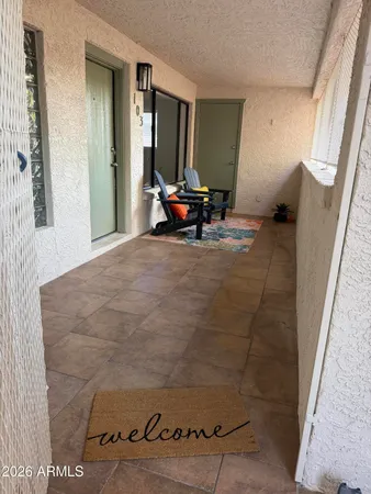 a living room with furniture and a rug