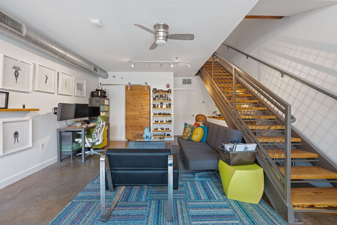 1601 East Cesar Chavez Street, Unit 104 Austin, TX 78702 - Photo 14 of 33 a living room with furniture and a wooden floor