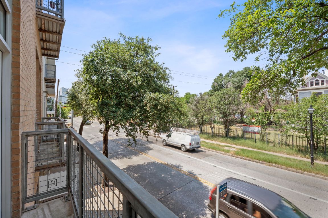 1601 East Cesar Chavez Street, Unit 104 Austin, TX 78702 - Photo 22 of 33 a view of a patio with table and chairs and couches