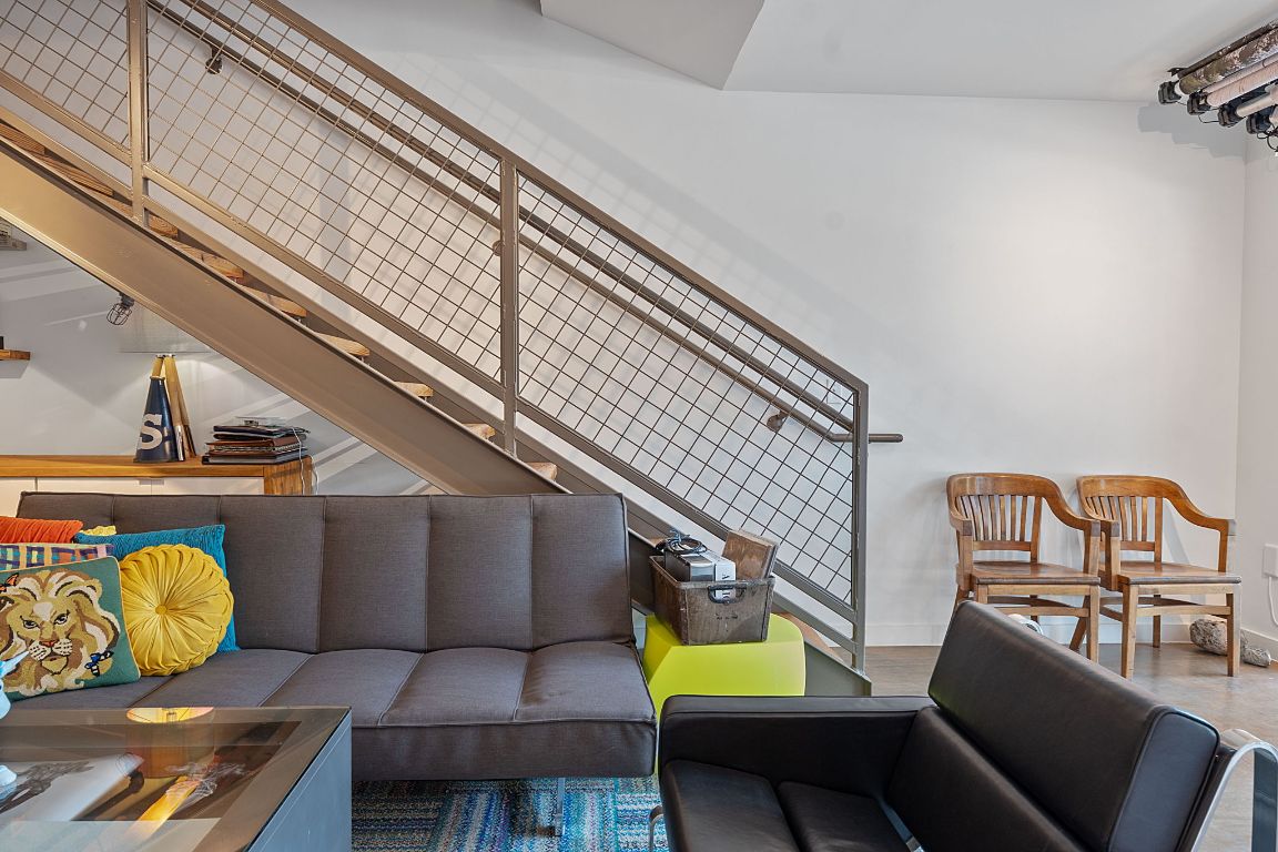 1601 East Cesar Chavez Street, Unit 104 Austin, TX 78702 - Photo 7 of 33 a view of staircase with seating area